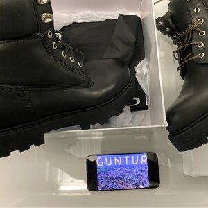 GIVENCHY
Black Show Logo-Debossed Leather Ankle Boots